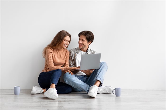 satisfied-young-caucasian-couple-look-at-laptop-pl-2022-12-16-08-35-52-utc.jpg